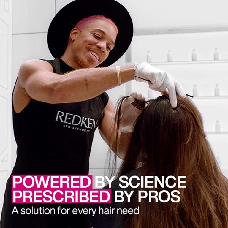 Professional hair styling done by a stylist in a salon - Redken India